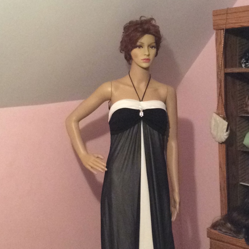 Full length black and white strapless gown